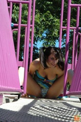 Danielle at the playground in pigtails, skirt, and thong