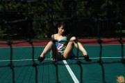 Danielle at the playground in pigtails, skirt, and thong