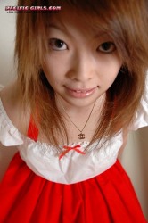 Asian girl in a red dress sucks a dick